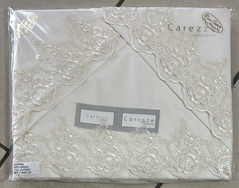 Coppia lenzuola Carezze Krizia in 100% puro cotone con rifinitura in pizzo rebrodè matrimoniale